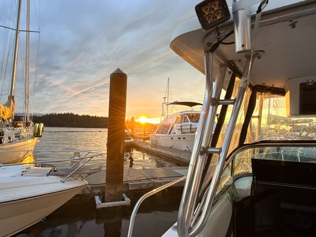 Warm coastal light beside the boat at the marina