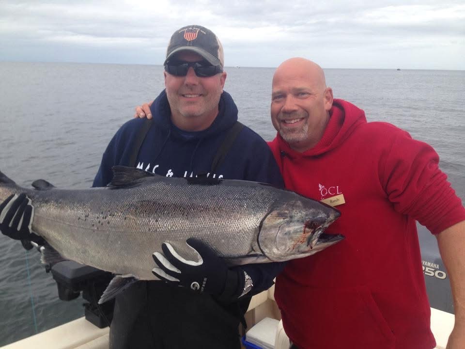 Guests with a salmon caught on a private charter