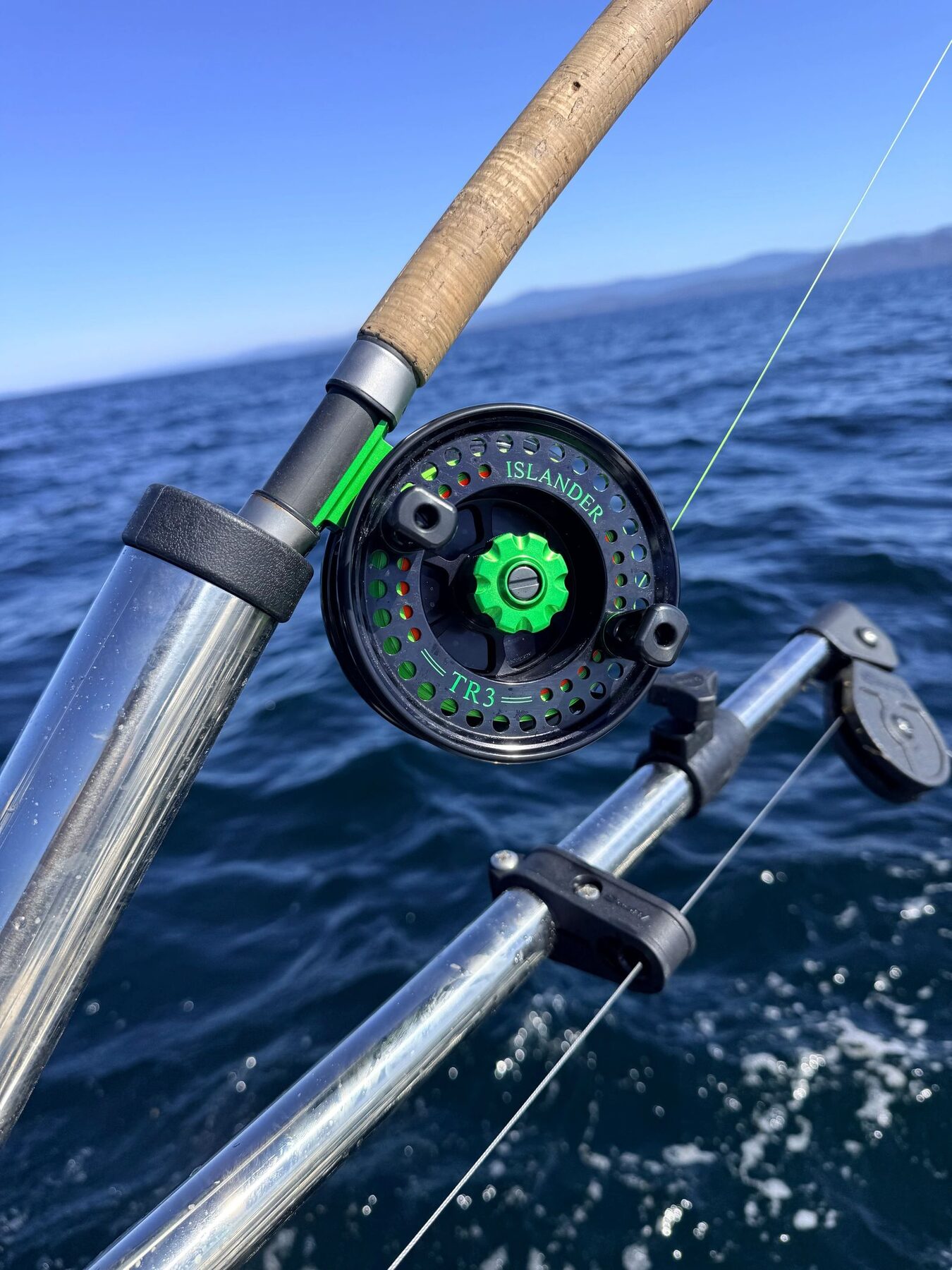 Premium fishing reel mounted aboard the charter boat